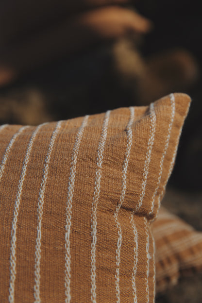 Close-up of a striped pillow with a blurred background