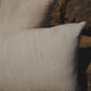 Two textured pillows on a stone surface